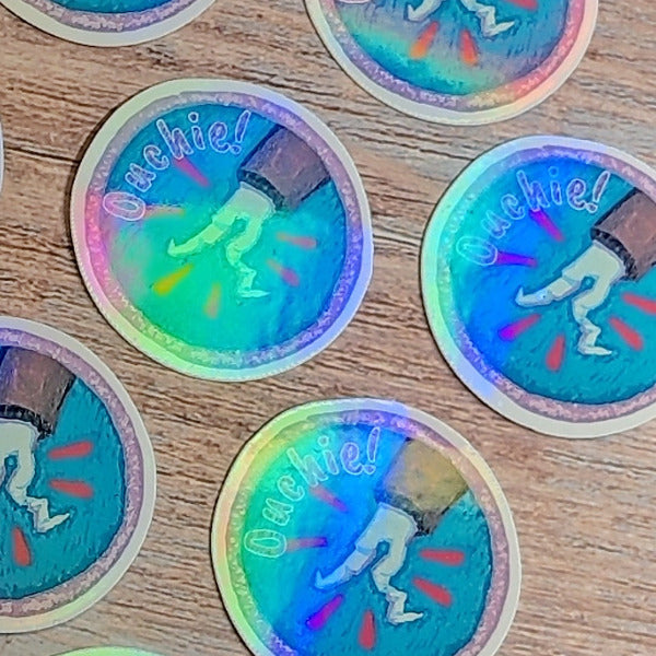 Ouchie! Dropped Pen Scout Badge-Holographic Waterproof Vinyl Sticker
